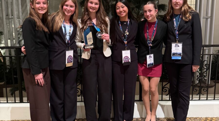 Members of the Northfield High School Business Professionals of America competed at the national competition. Claire Forbord earned third place in her event and is holding her trophy.