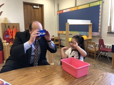 Superintendent Hillmann and a pre-schooler in 2018.