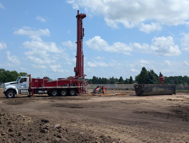 The geothermal well drilling rig was mobilized to the Northfield High School Construction site.