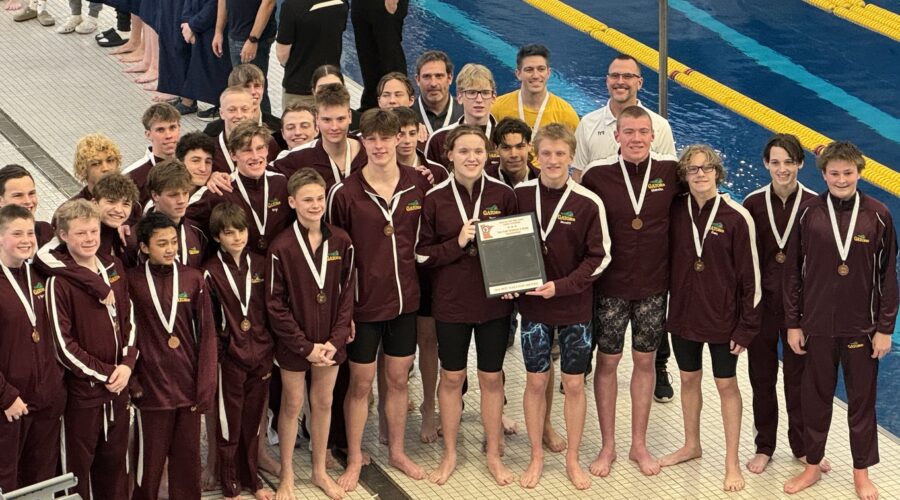 The NHS Boys Swim and Dive team after winning third place in the 2026 True Team State Event.