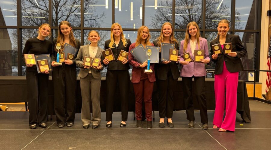 Eight students show their regional award from Business Professionals of America.