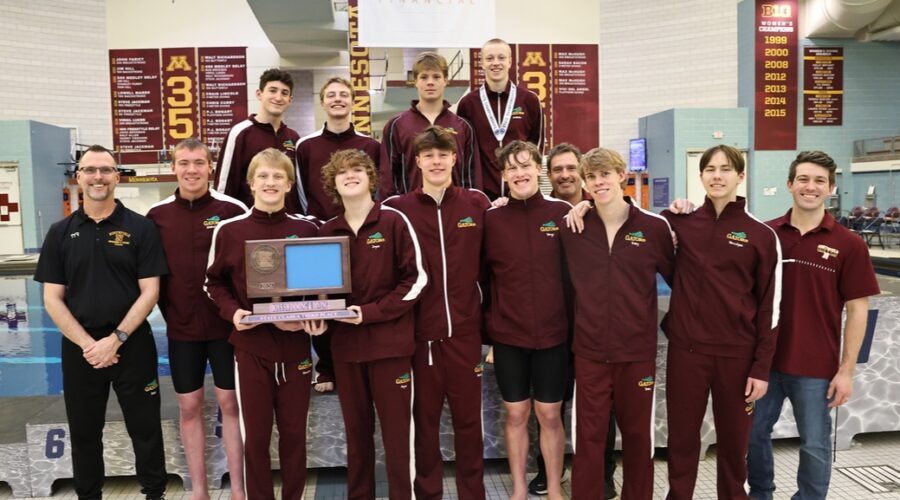 The Northfield Boys Swim and Dive team takes third place at the state tournament. Pictured is the team holding their trophy.