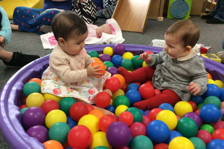 Babies playing in ball pit