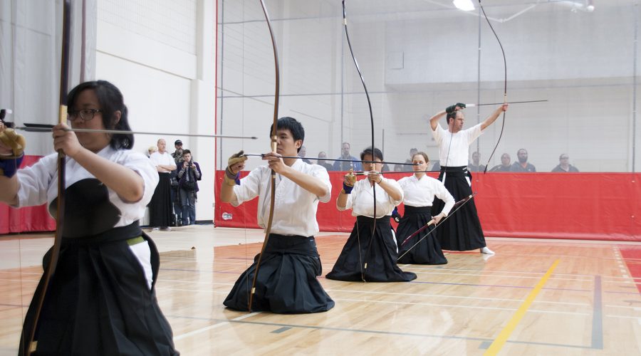 Participants show form in Kyudo class